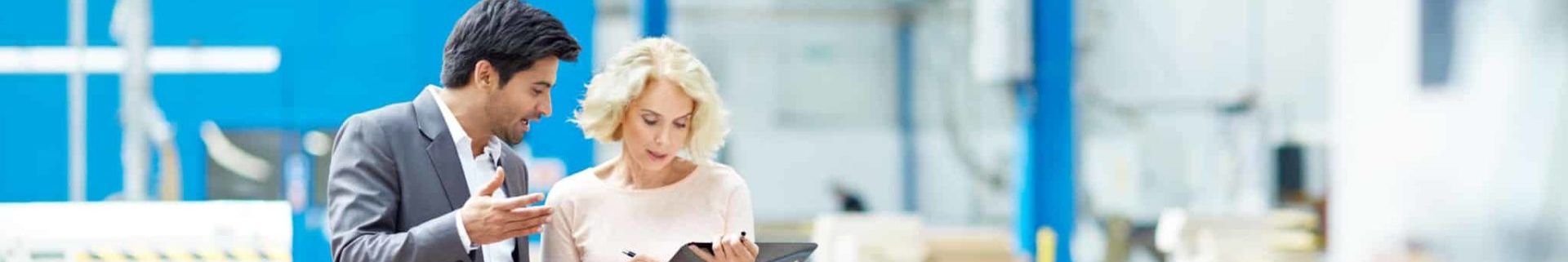 businessman reporting production details to senior manager
